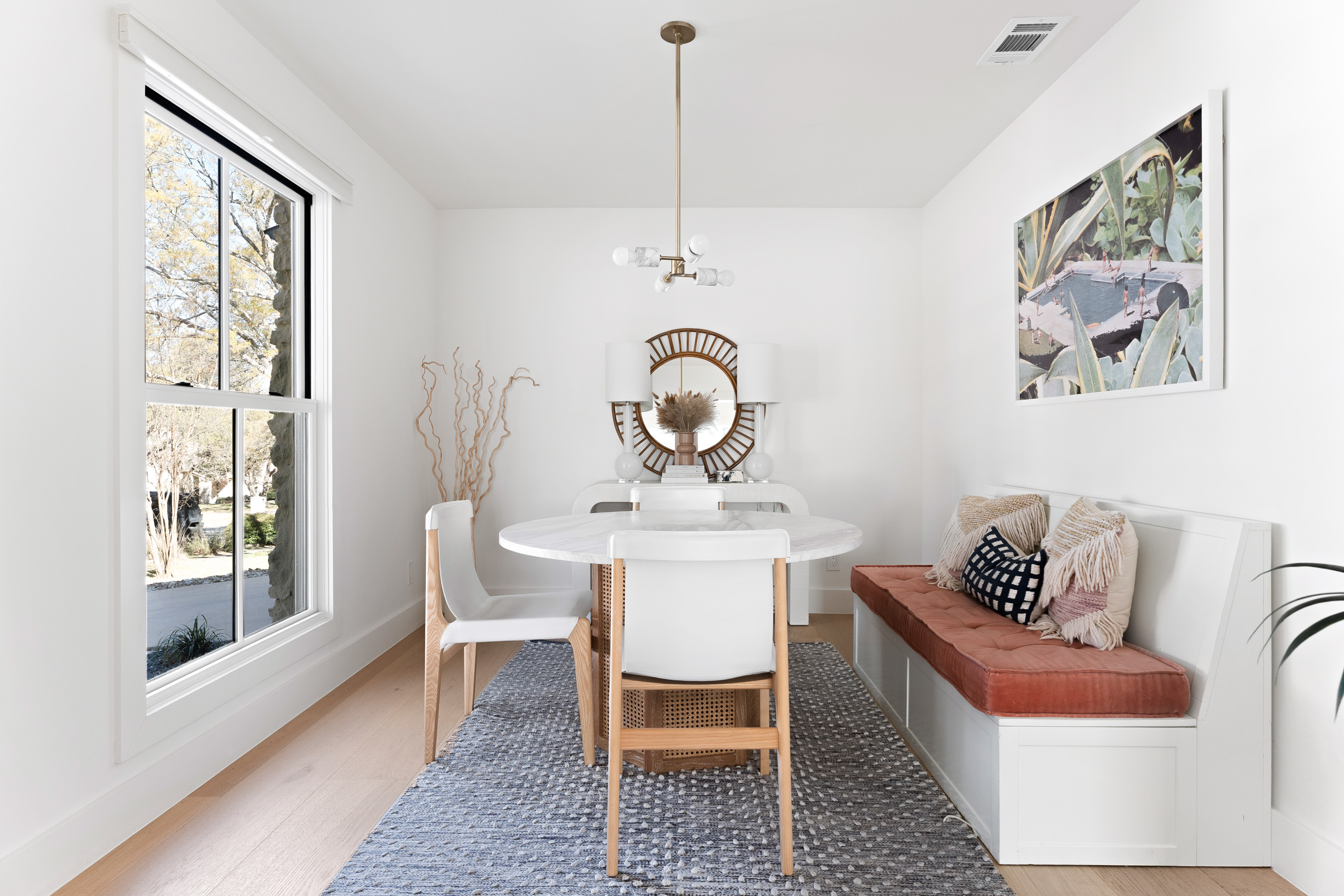 1317 Thaddeus Cove Austin, TX 78746 - Photo 9 of 22 a view of a dining room with furniture window and wooden floor
