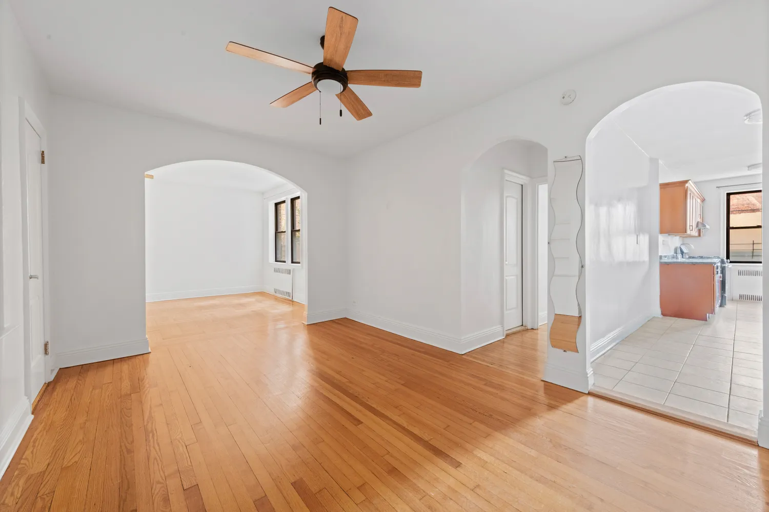 a view of a room with a ceiling fan