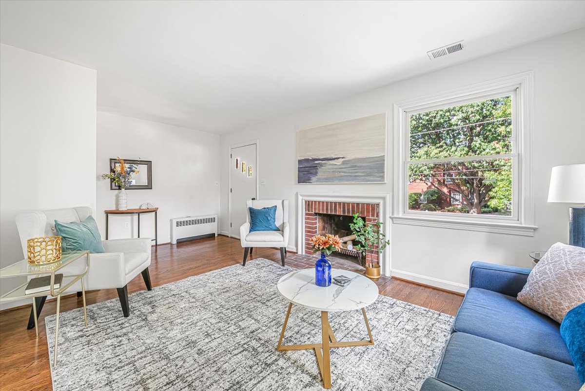 1902 Rookwood Road Silver Spring, MD 20910 - Photo 5 of 36 a living room with furniture and a fireplace