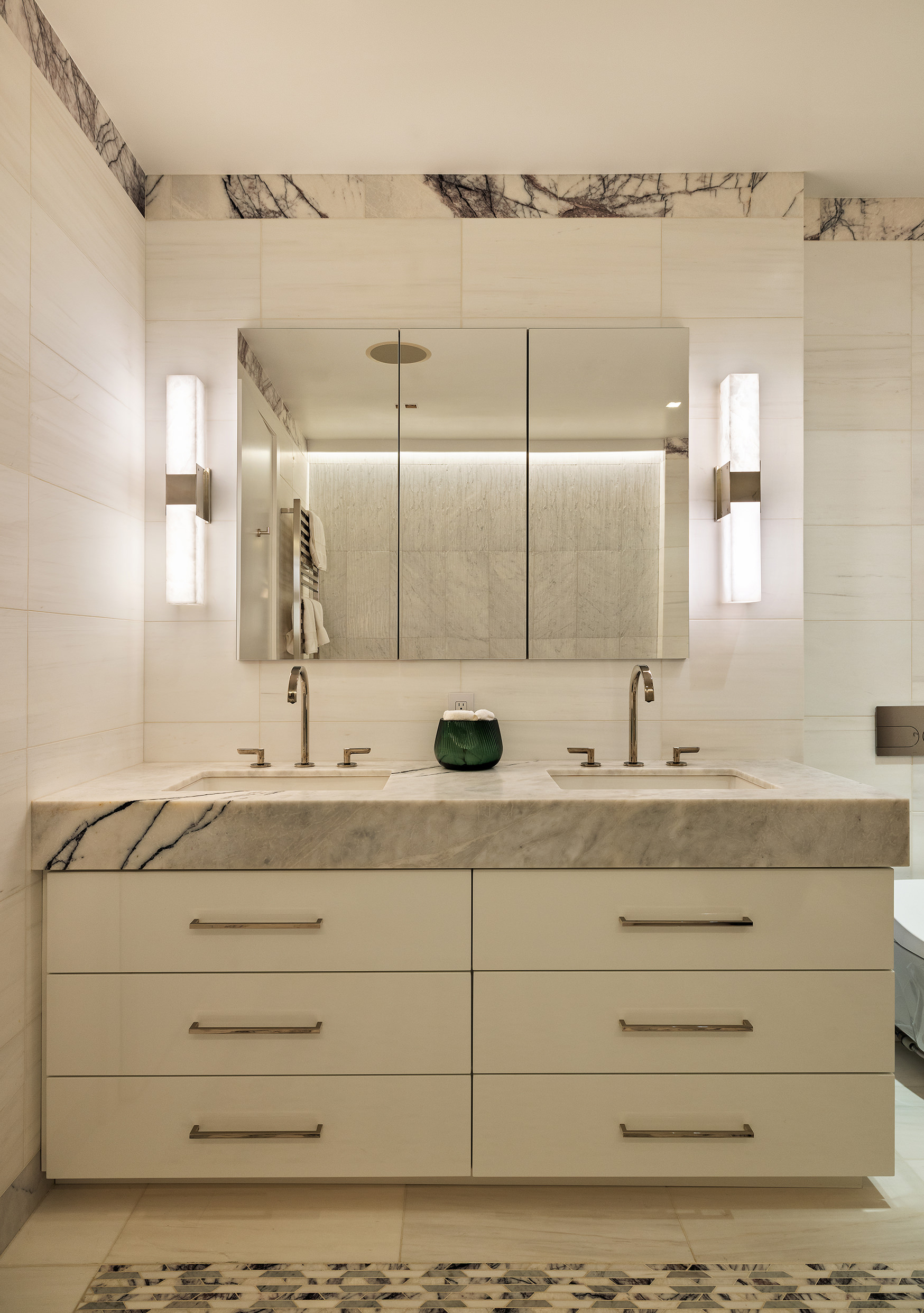 53 Greene Street, Unit 3 Manhattan, NY 10013 - Photo 15 of 22 a bathroom with a double vanity sink and mirror