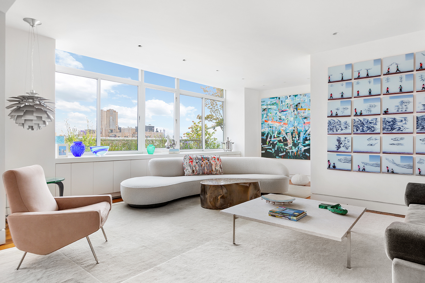 2373 Broadway, Unit PH1 Manhattan, NY 10024 - Photo 1 of 28 a living room with furniture and a large window