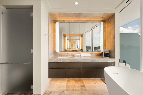 a bathroom with a glass shower door