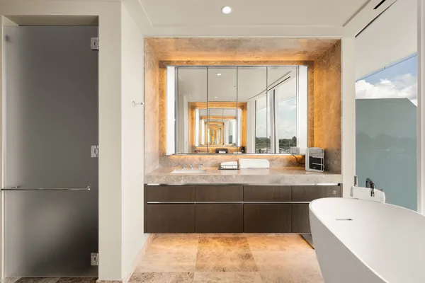 a bathroom with a glass shower door