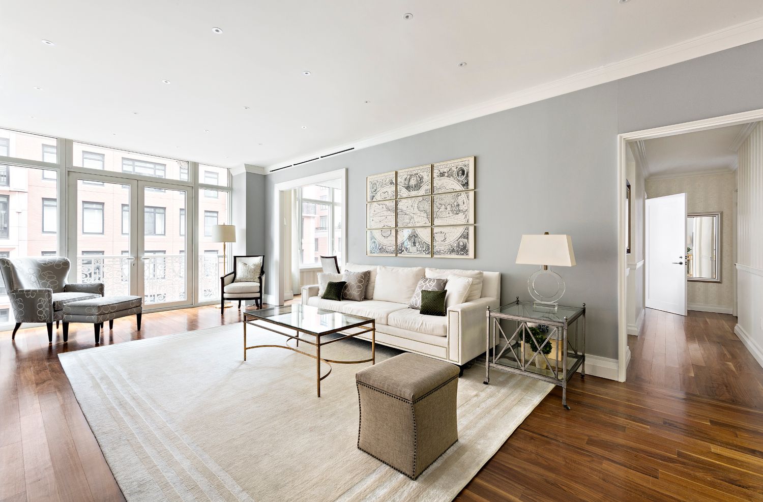 2150 Broadway, Unit 9E Manhattan, NY 10023 - Photo 2 of 14 a living room with furniture and a table with wooden floor