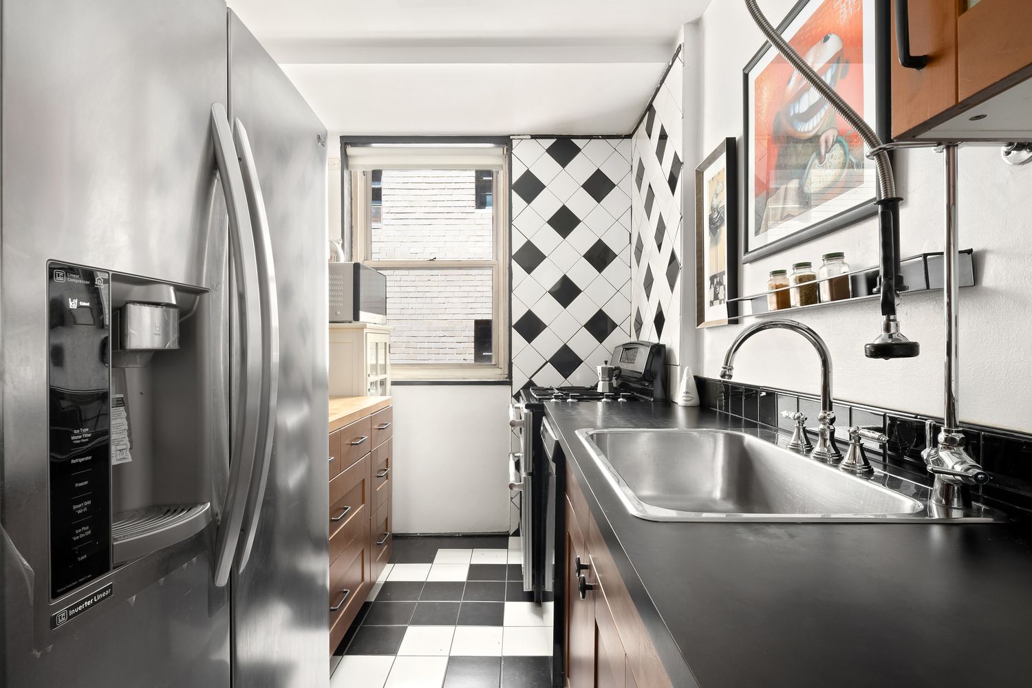 63 East 9th Street, Unit 4U Manhattan, NY 10003 - Photo 4 of 6 a close view of a sink and refrigerator