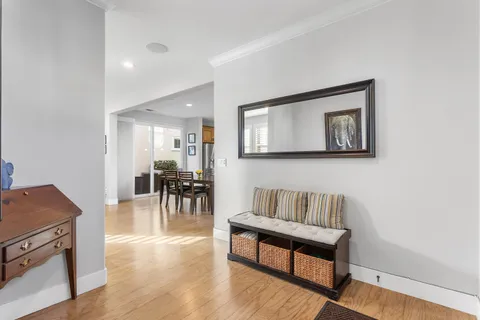 a view of room with window and wooden floor