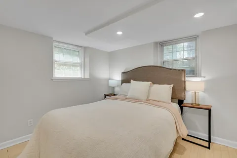 a bedroom with a bed and window