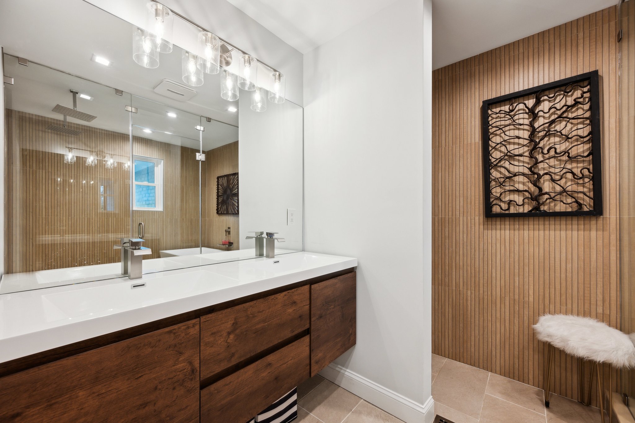 2607 Ross Road Chevy Chase, MD 20815 - Photo 19 of 37 a bathroom with a double vanity sink a mirror and shower