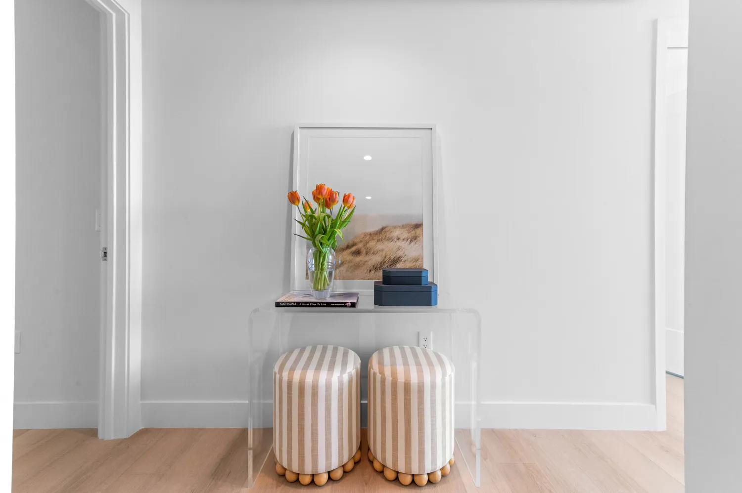 a kitchen with a table chairs refrigerator and cabinets