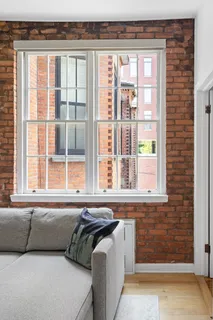 a living room filled with furniture and a window