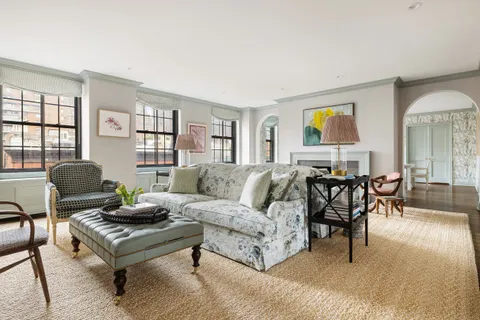 a living room with furniture and a window