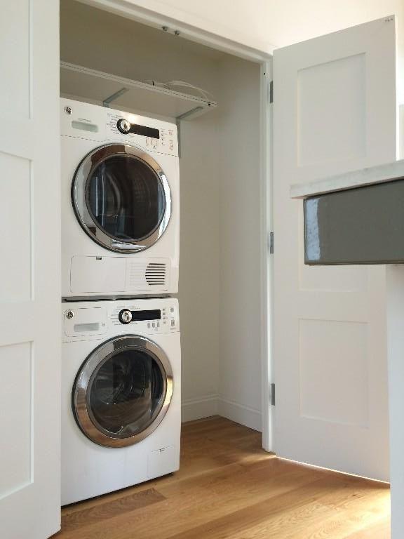 224 Wythe Avenue, Unit 68E Brooklyn, NY 11249 - Photo 7 of 10 a view of a hallway with washer and dryer