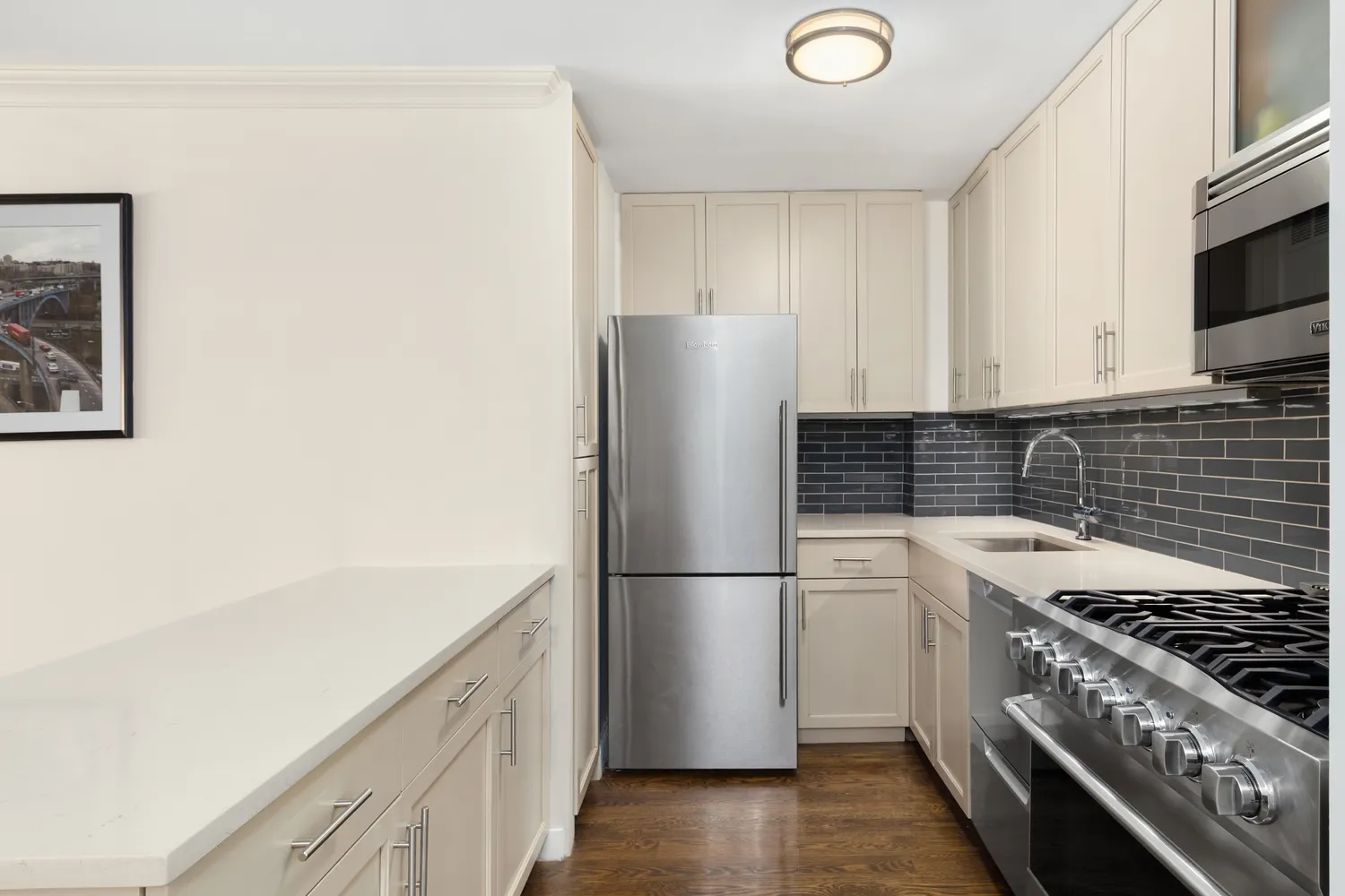 a kitchen with a refrigerator and a stove