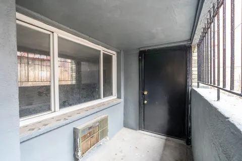 a view of a bathroom with a sink and window