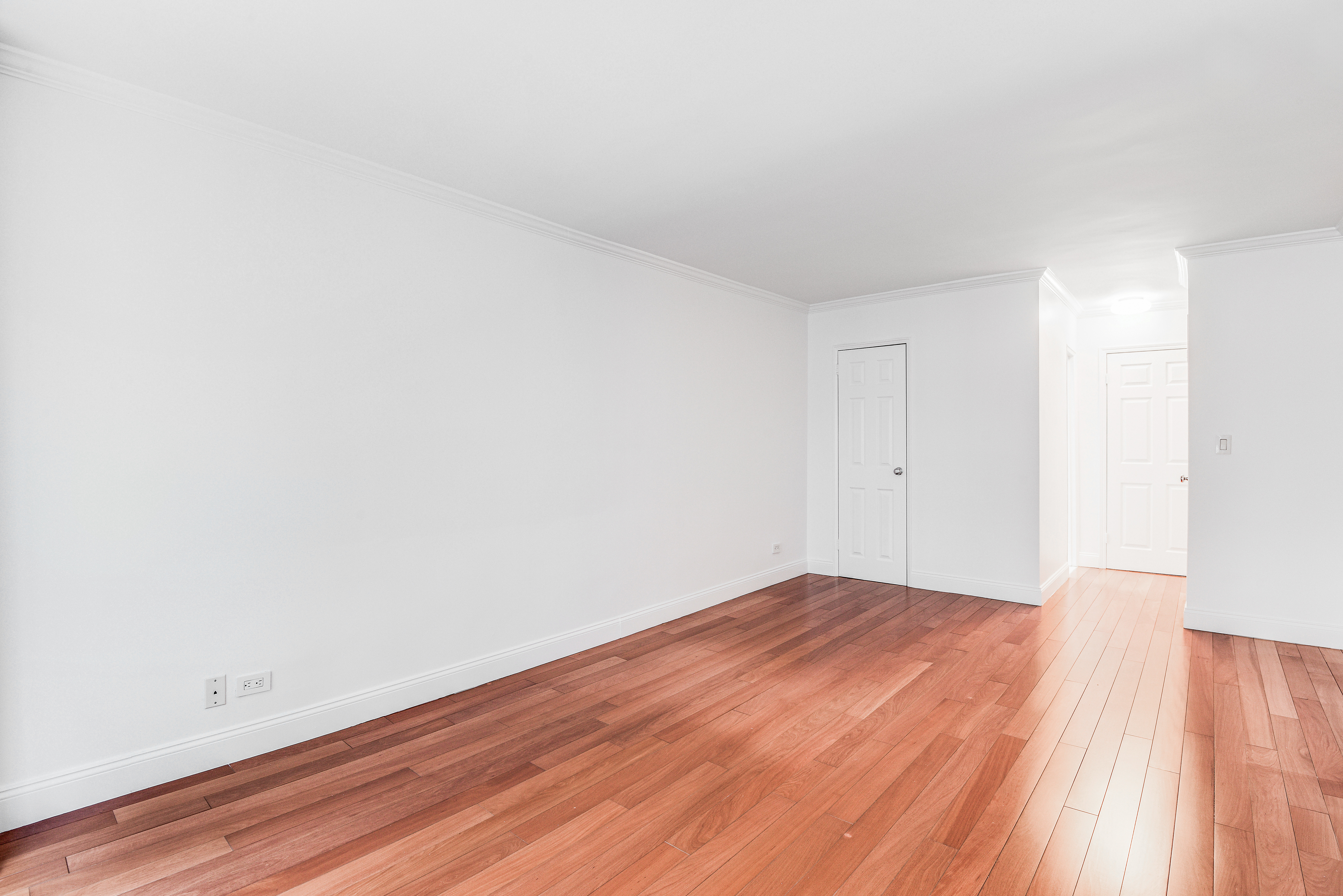 200 Central Park South, Unit 5M Manhattan, NY 10019 - Photo 9 of 15 a view of empty room with wooden floor