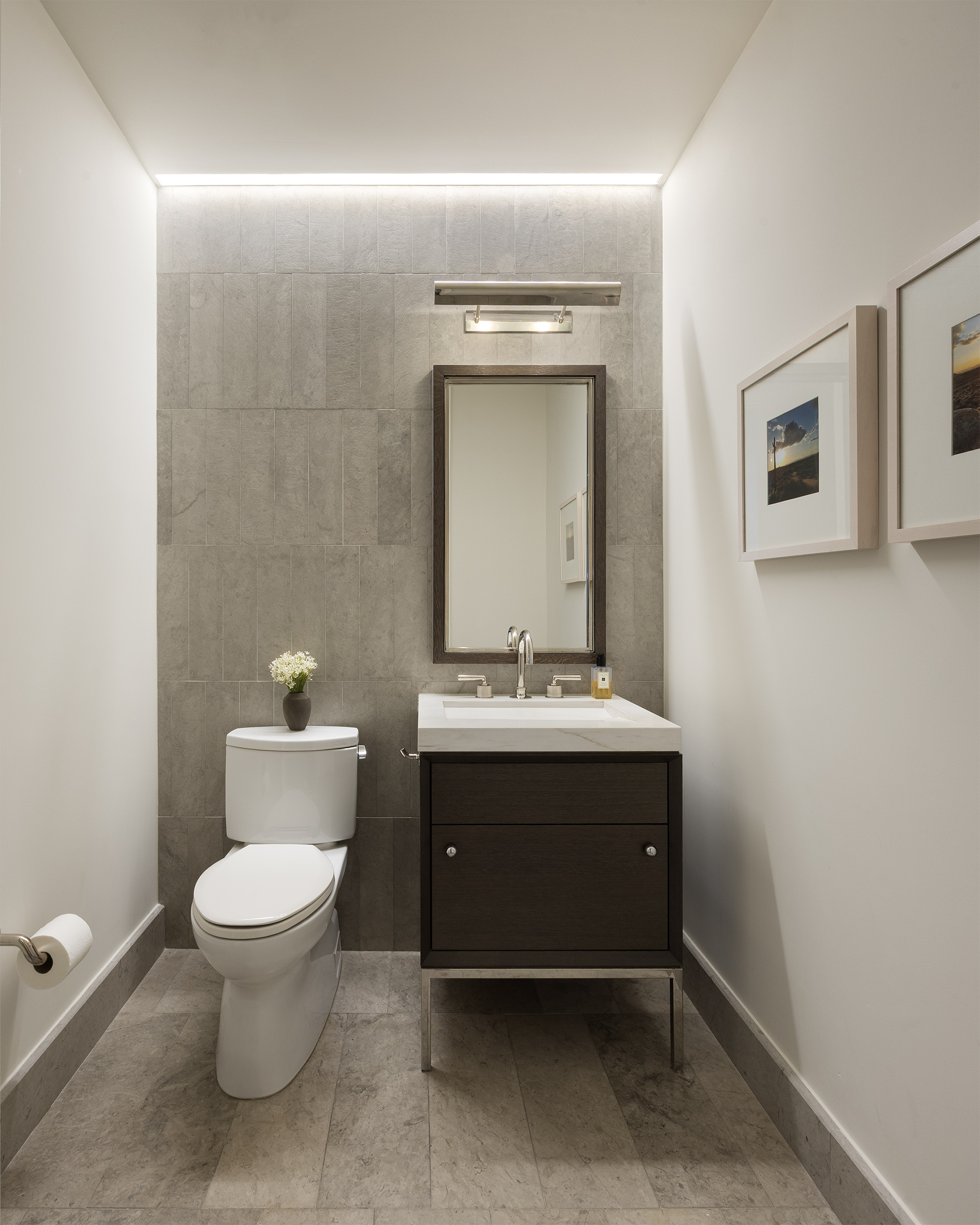 301 East 50th Street, Unit 16B Manhattan, NY 10022 - Photo 11 of 15 a bathroom with a toilet sink and mirror