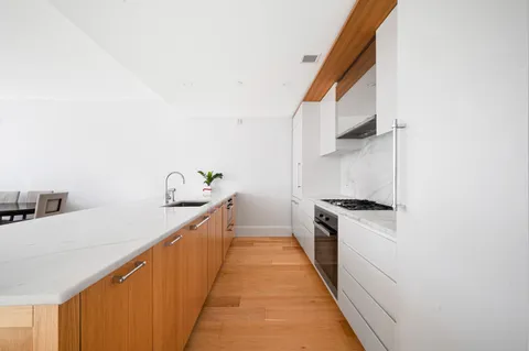 a kitchen with a stove and a sink