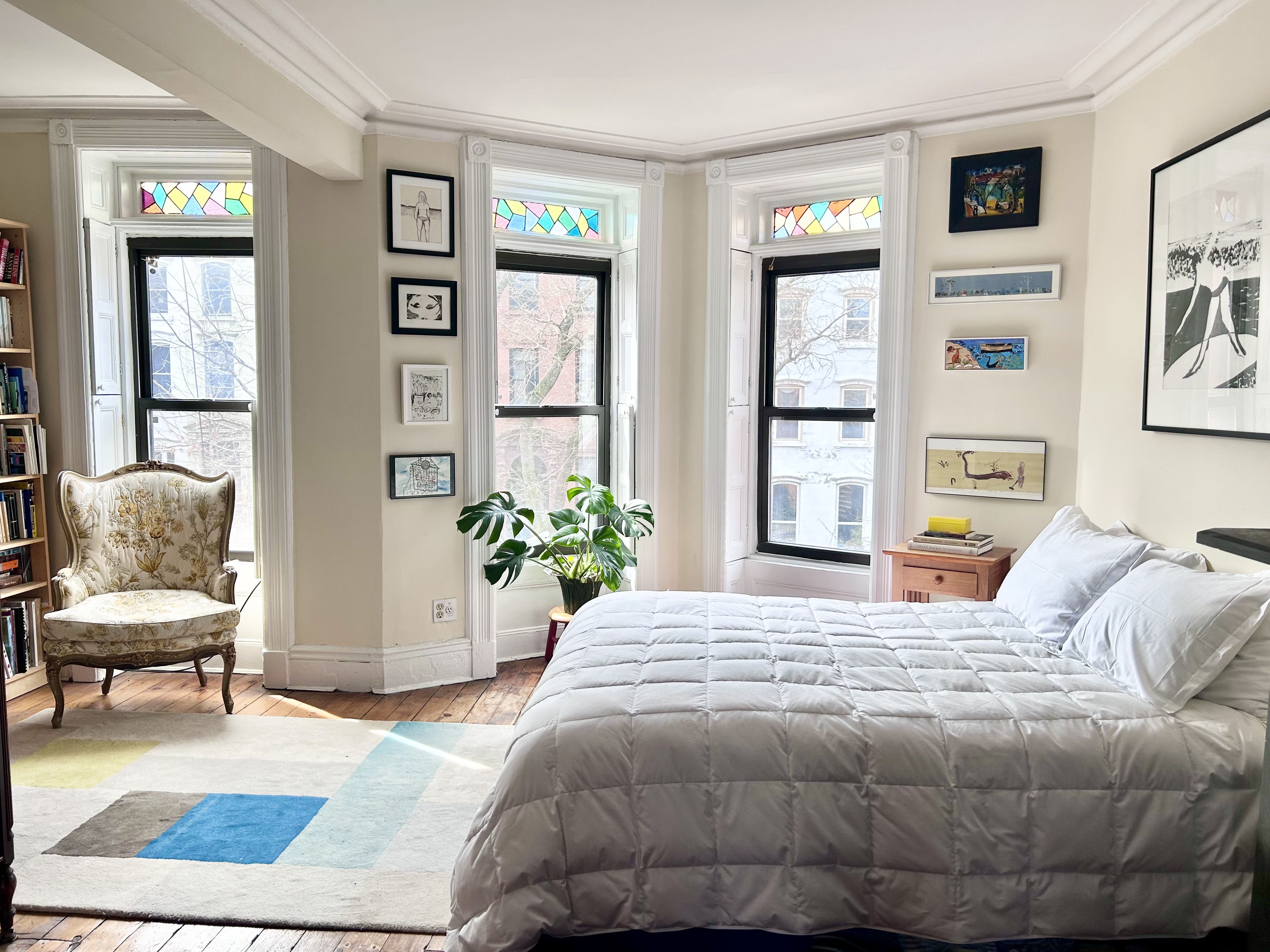 173 Garfield Place Brooklyn, NY 11215 - Photo 6 of 14 a bedroom with a bed and painting on the wall