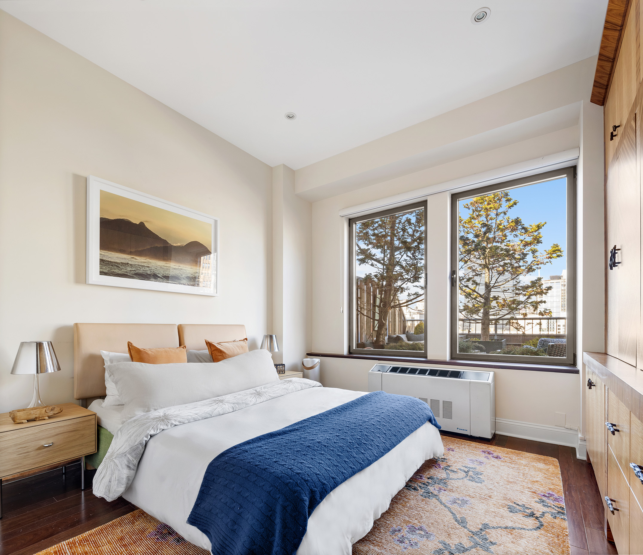 252 7th Avenue, Unit PHG Manhattan, NY 10001 - Photo 21 of 27 a bedroom with a bed and a large window