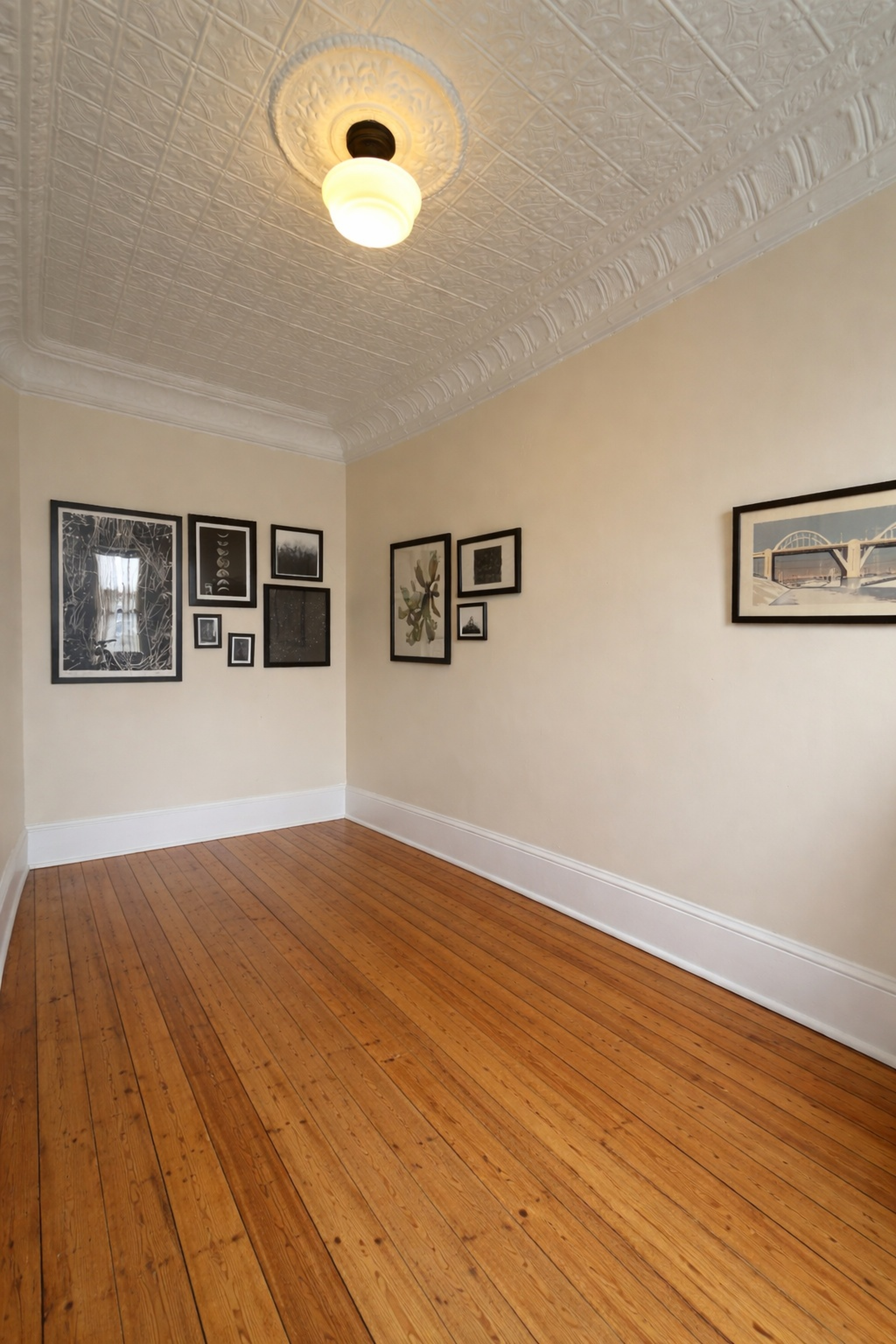 481 9th Street, Unit 4 Brooklyn, NY 11215 - Photo 9 of 33 a view of empty room with wooden floor and fan