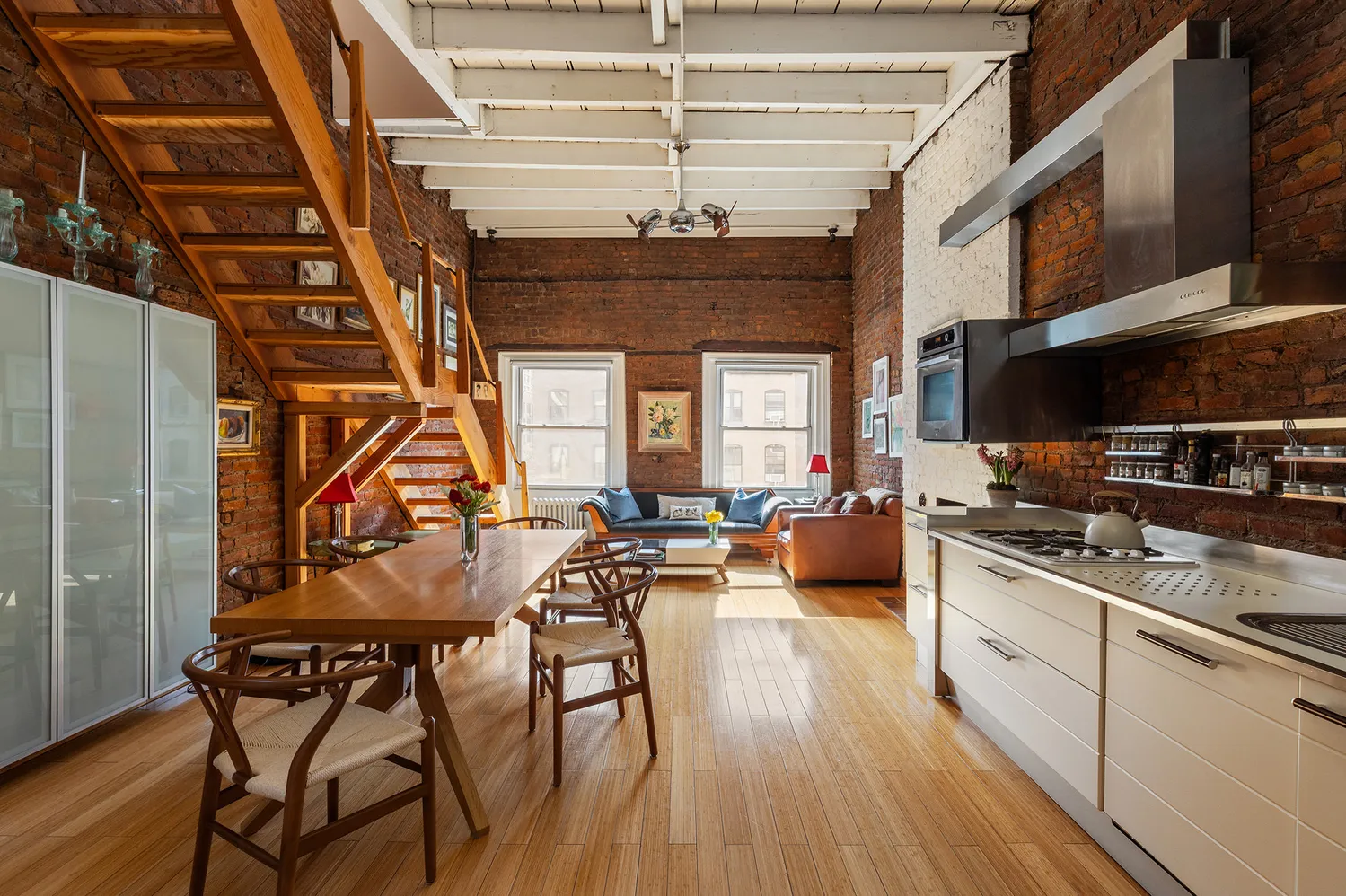 a kitchen with stainless steel appliances granite countertop a stove and cabinets