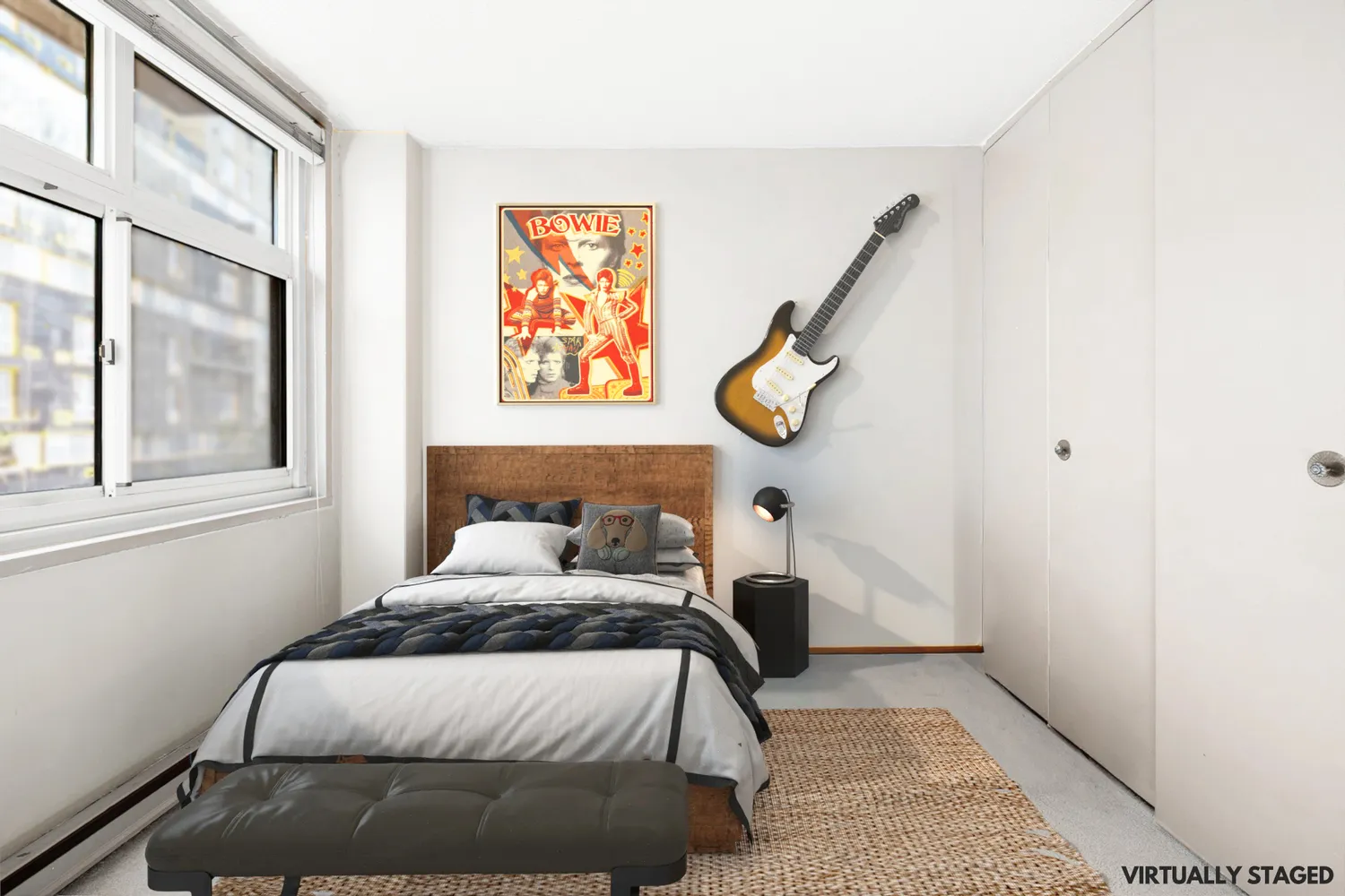 a bedroom with a bed and painting on the wall