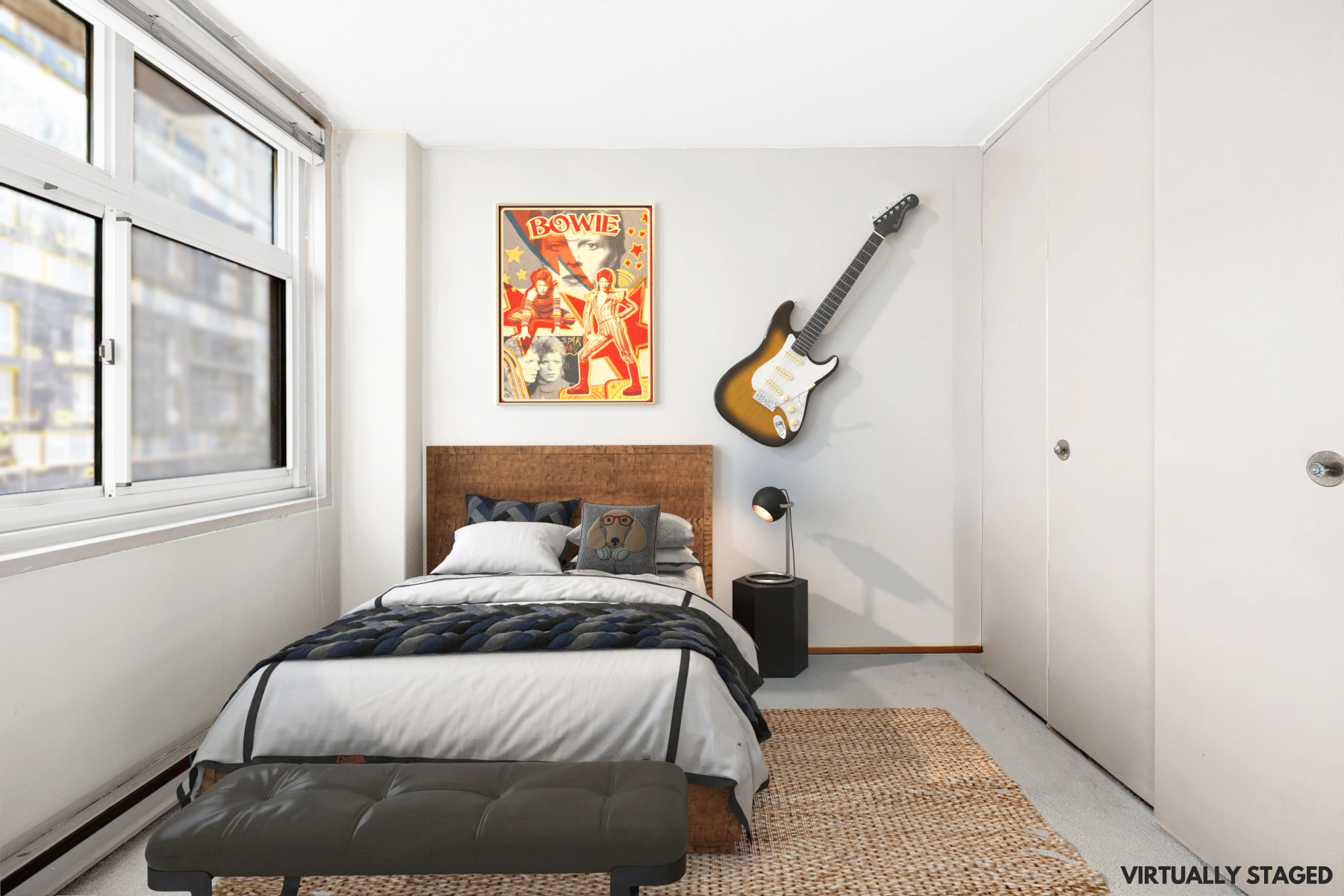 555 Main Street, Unit 512 Manhattan, NY 10044 - Photo 9 of 18 a bedroom with a bed and painting on the wall