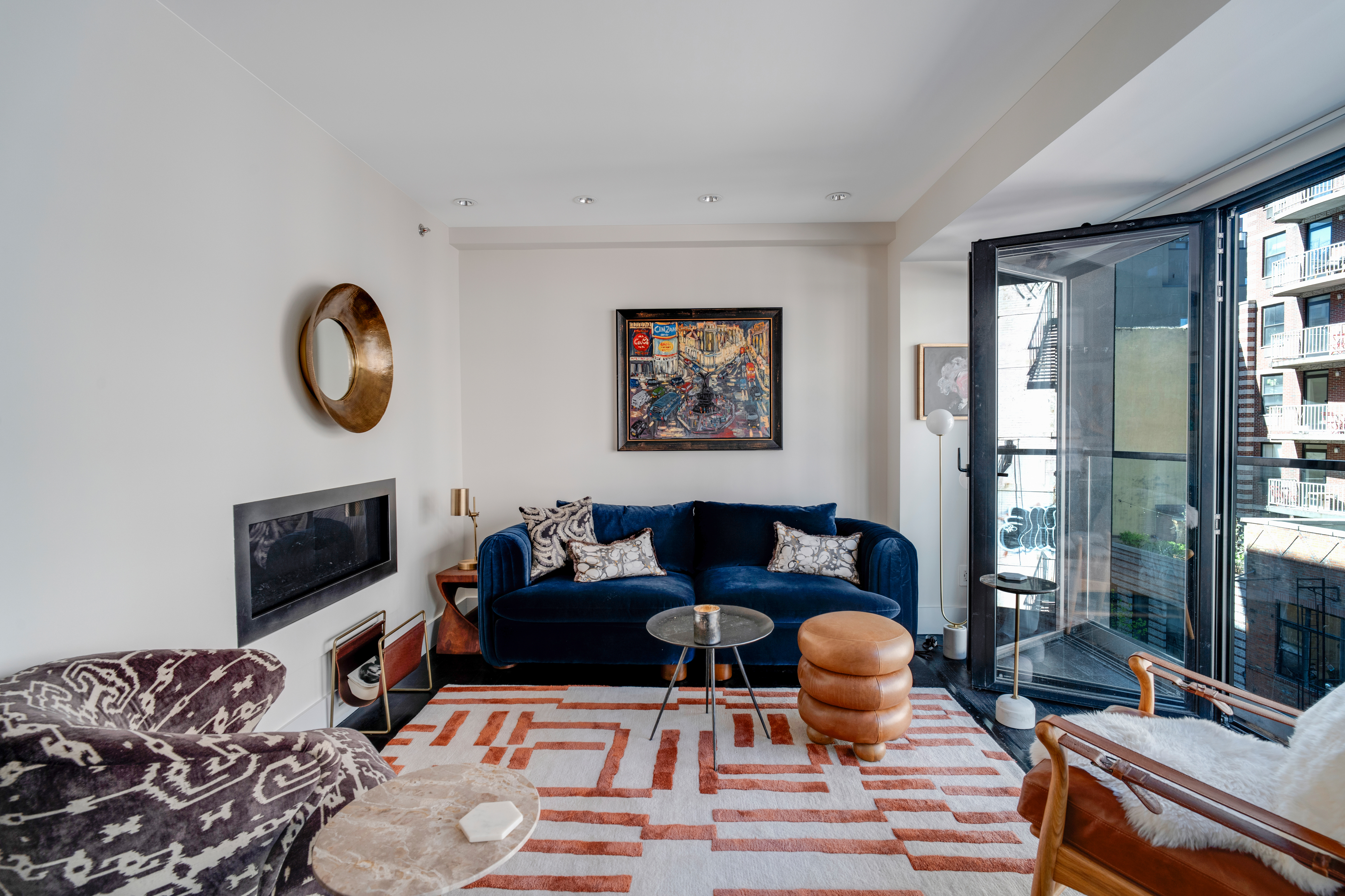 60 Orchard Street, Unit 4 Manhattan, NY 10002 - Photo 4 of 18 a living room with furniture fireplace and flat screen tv
