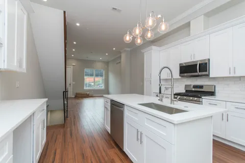 a kitchen that has a lot of cabinets in it