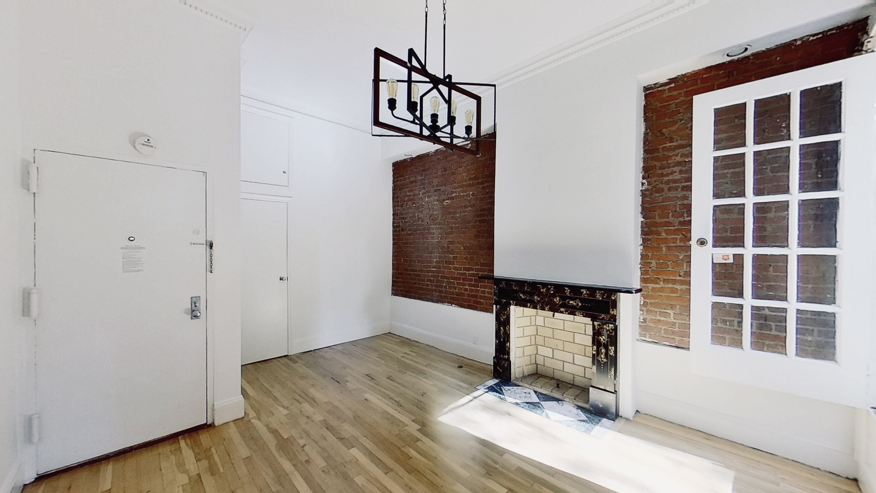 347 5th Avenue, Unit 1L Brooklyn, NY 11215 - Photo 3 of 10 a view of a room with wooden floor and windows
