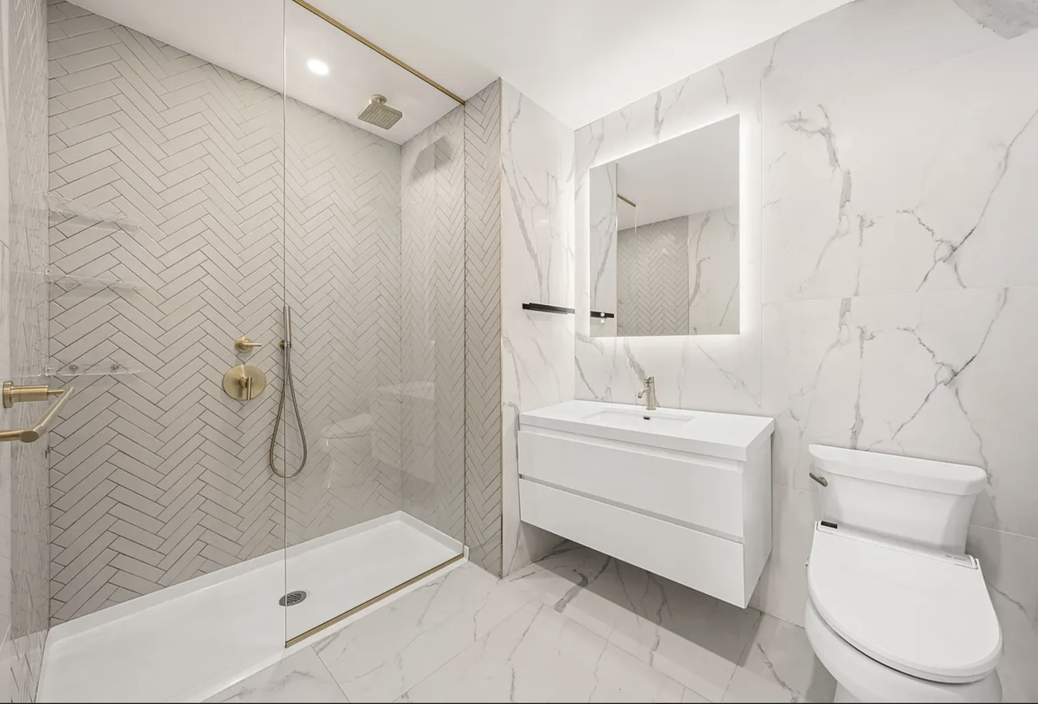 17 West 24th Street, Unit 4 Manhattan, NY 10010 - Photo 7 of 8 a bathroom with a sink a toilet and shower