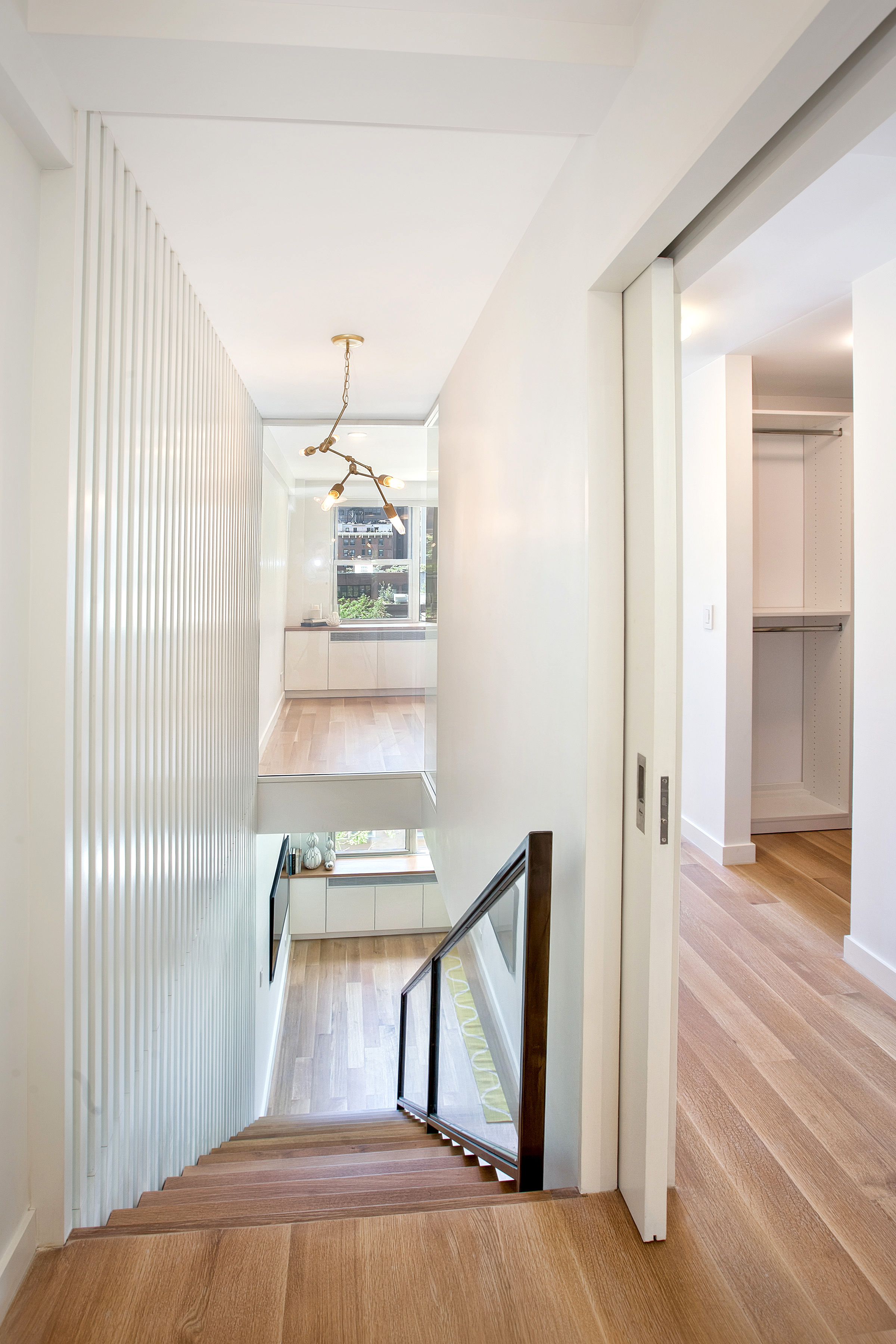 221 East 50th Street, Unit 6D/7D Manhattan, NY 10022 - Photo 9 of 19 a view of a livingroom with furniture window and wooden floor