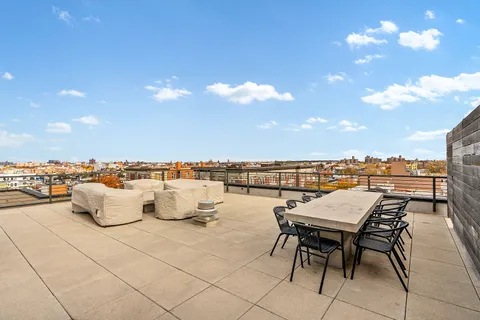 a view of a terrace with furniture and a terrace view