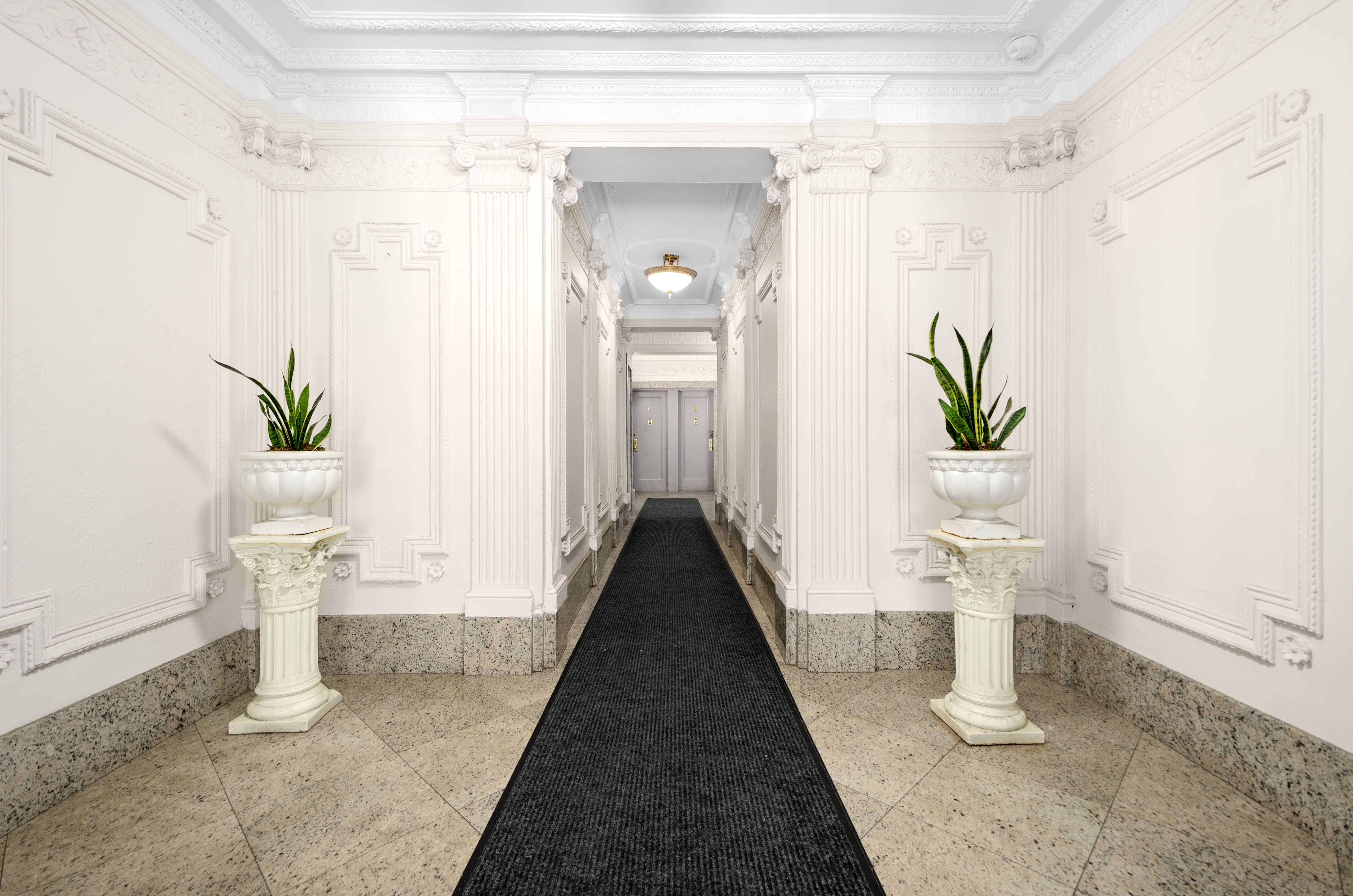 465 Eastern Parkway, Unit D Brooklyn, NY 11216 - Photo 2 of 7 a living room with furniture and a potted plant