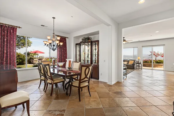 a dining room with furniture and window