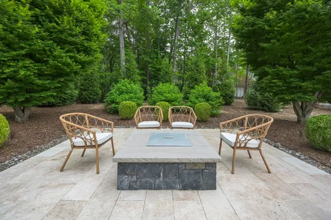 a view of house with outdoor space and sitting area