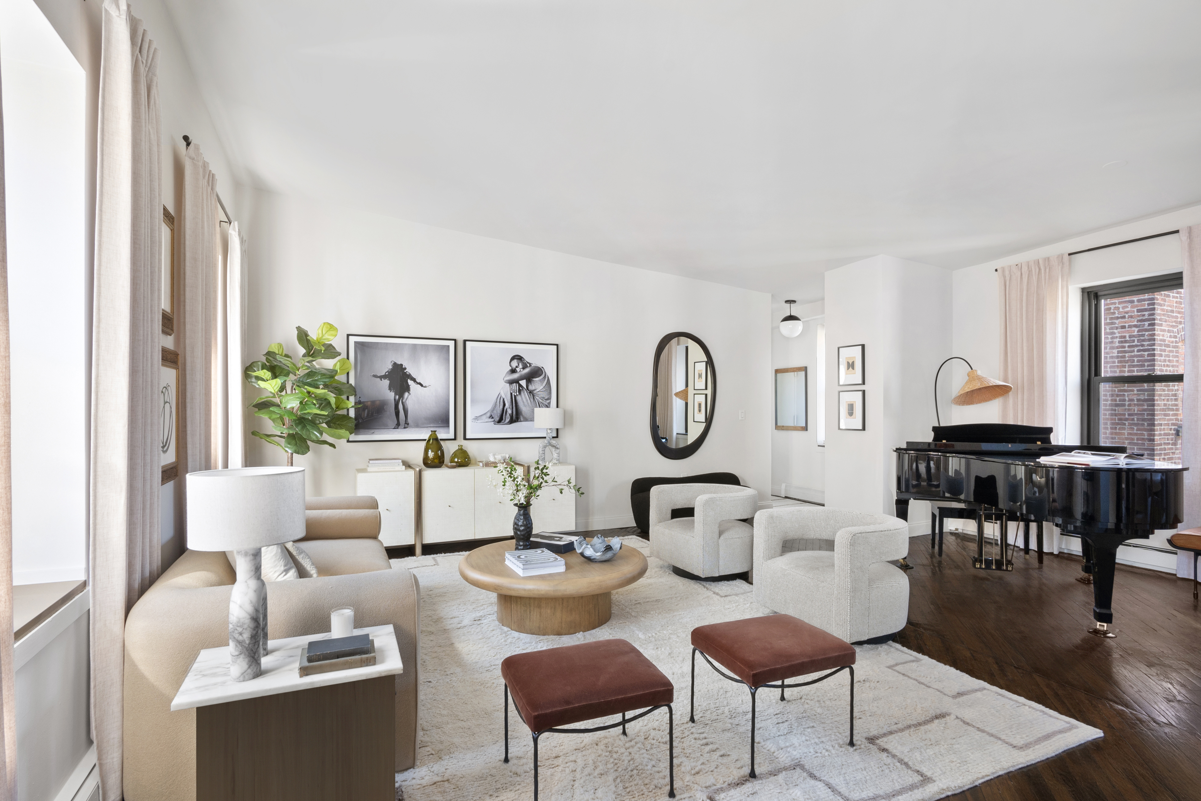 454 West 46th Street, Unit 5CS Manhattan, NY 10036 - Photo 3 of 25 a living room with furniture a rug and a window