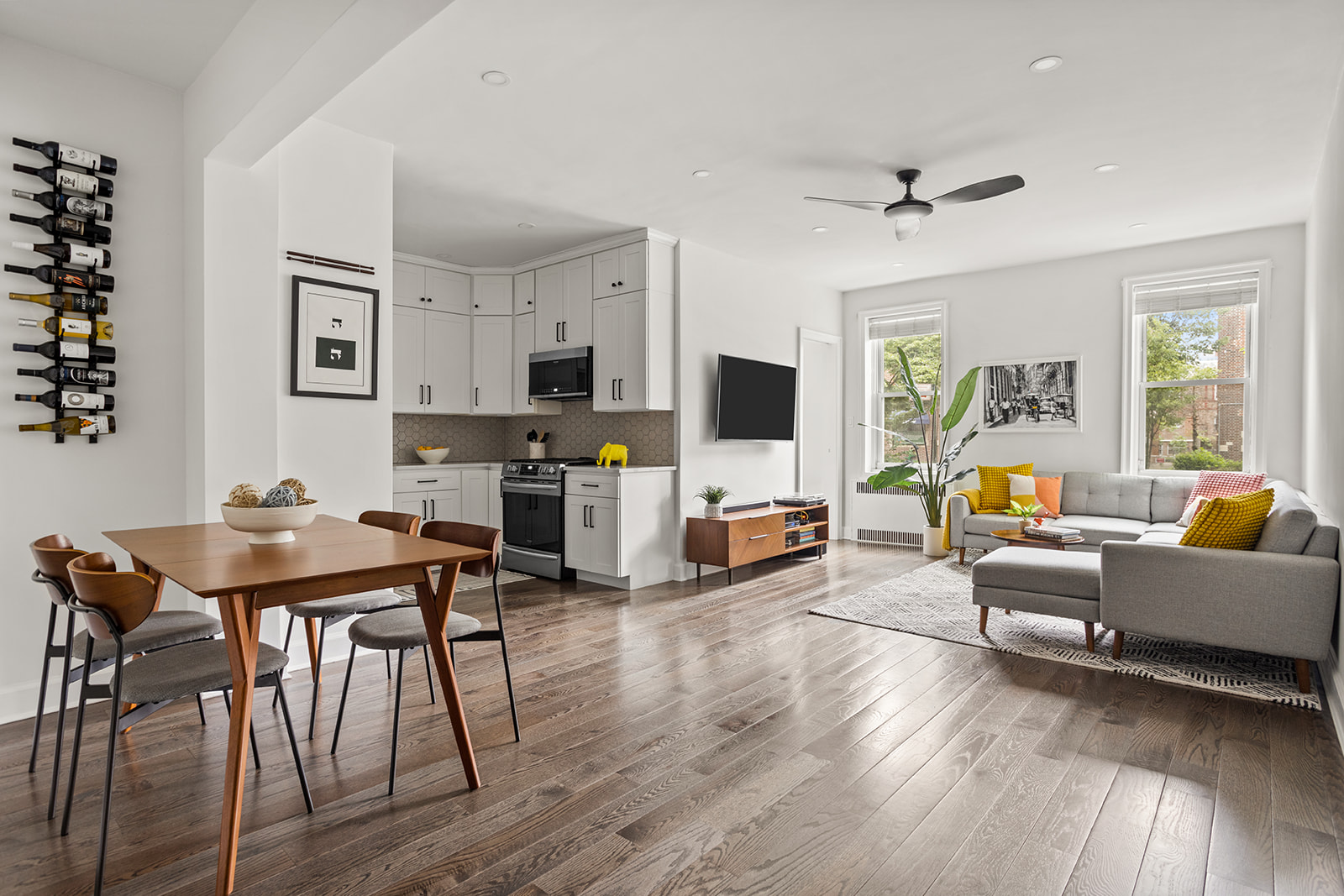 72-17 34th Avenue, Unit 1P Queens, NY 11372 - Photo 2 of 14 a living room with furniture and wooden floor