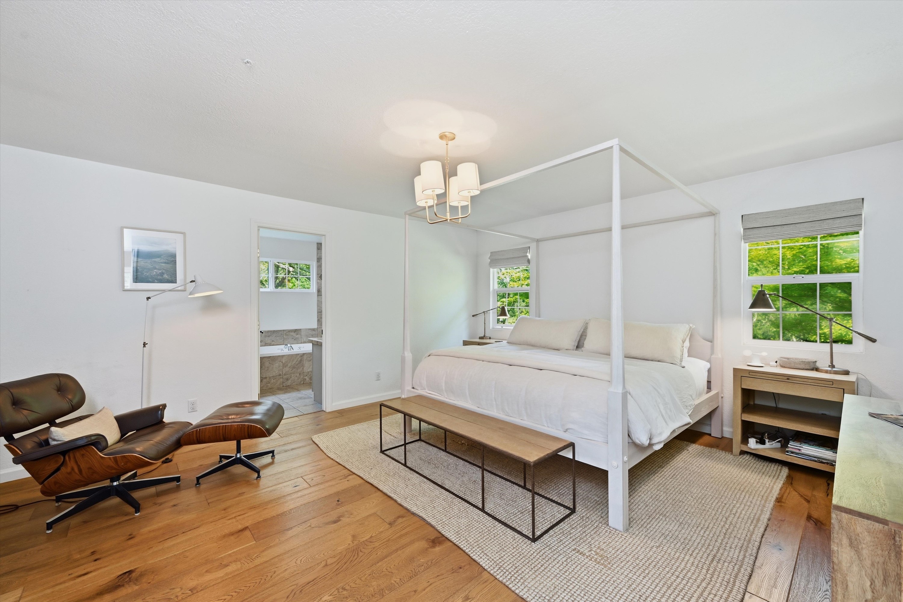 1541 Chablis Road Healdsburg, CA 95448 - Photo 13 of 19 a bedroom with a bed and a chandelier