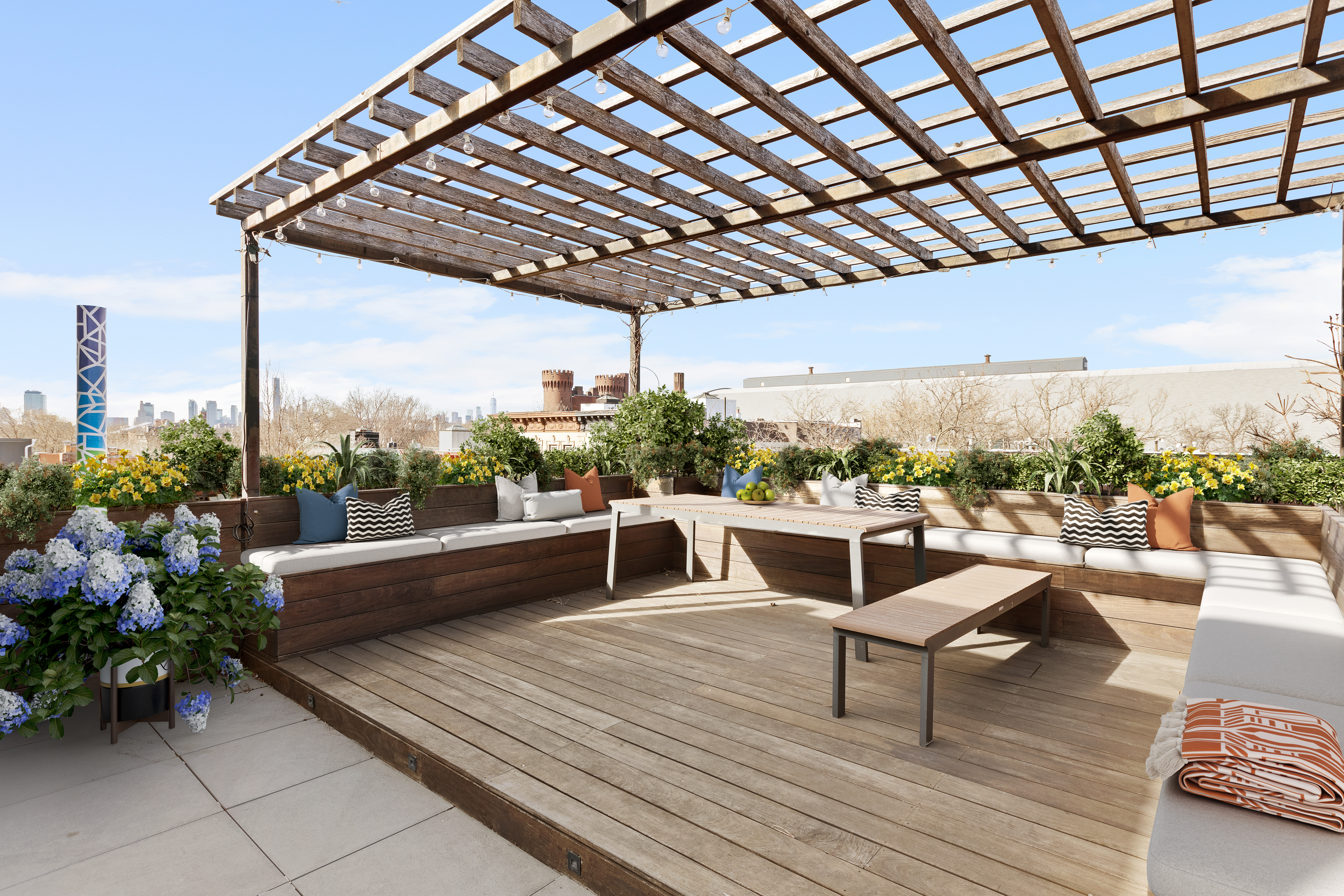 476 Hancock Street, Unit 3 Brooklyn, NY 11233 - Photo 3 of 9 a roof deck with table and chairs