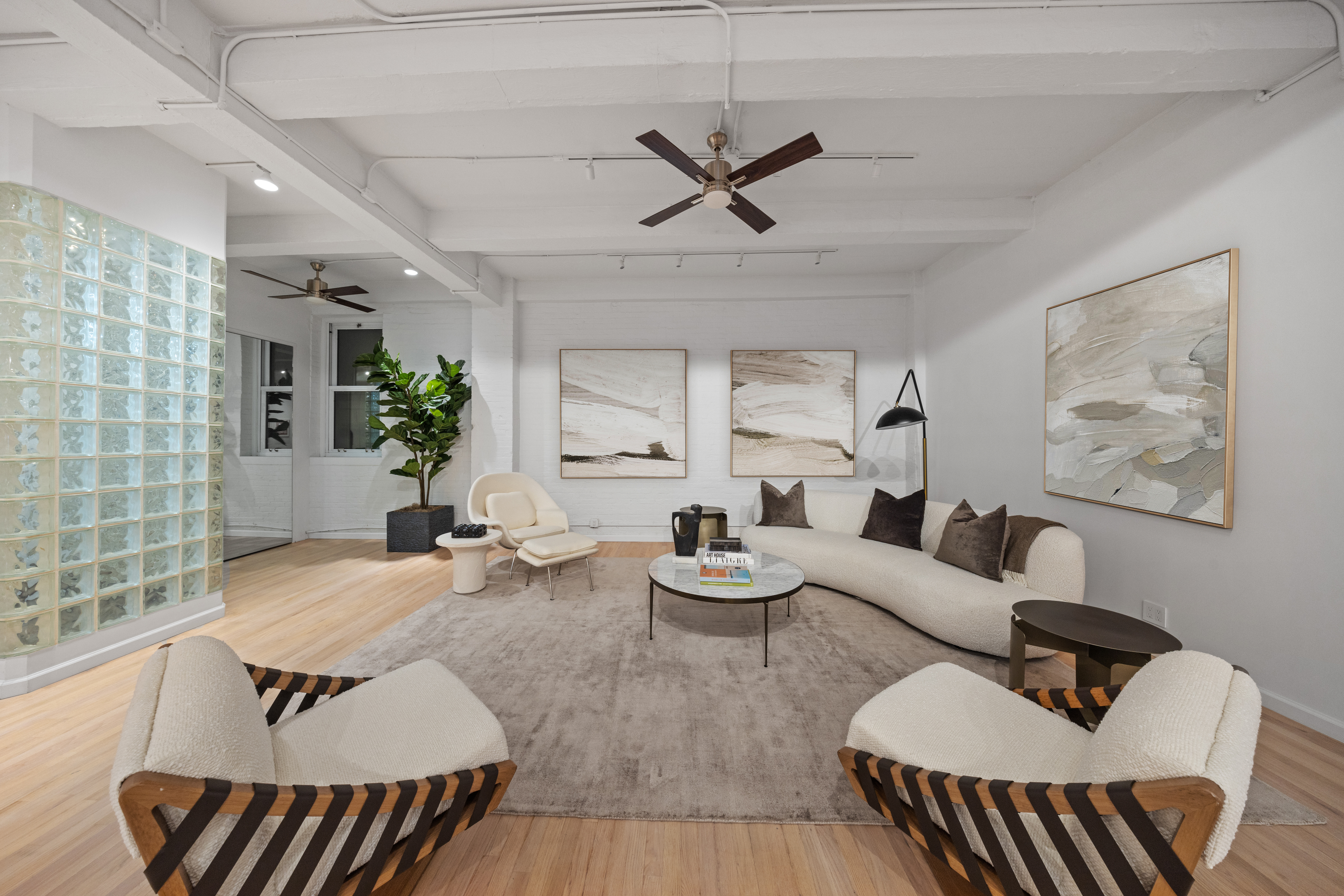 95 Vandam Street, Unit 2R Manhattan, NY 10013 - Photo 3 of 21 a living room with furniture and wooden floor
