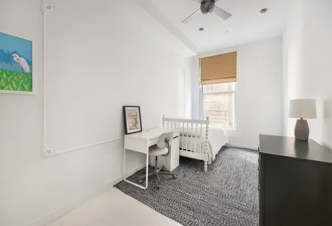 a workspace with furniture and window