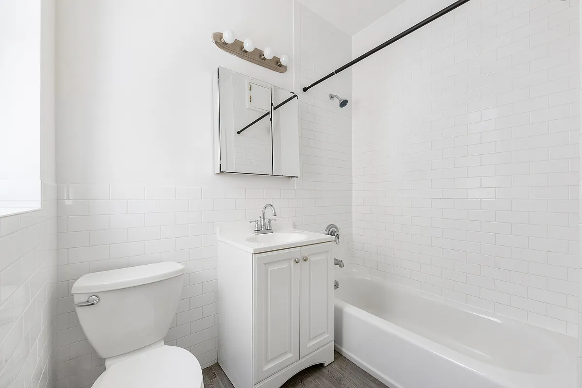 167 West 72nd Street Manhattan, NY 10023 - Photo 11 of 25 a bathroom with a toilet sink and bathtub