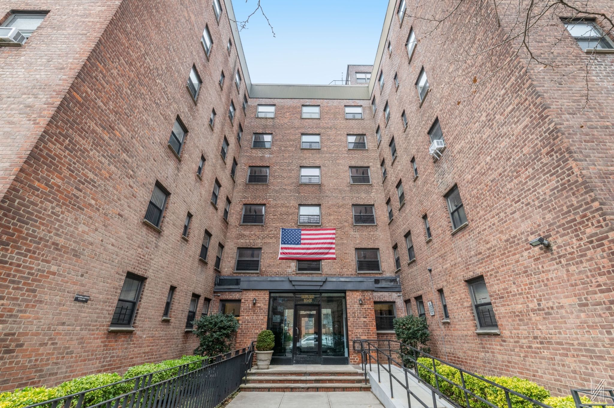 34-10 94th Street, Unit 6G Queens, NY 11372 - Photo 18 of 19 a front view of a building with a yard