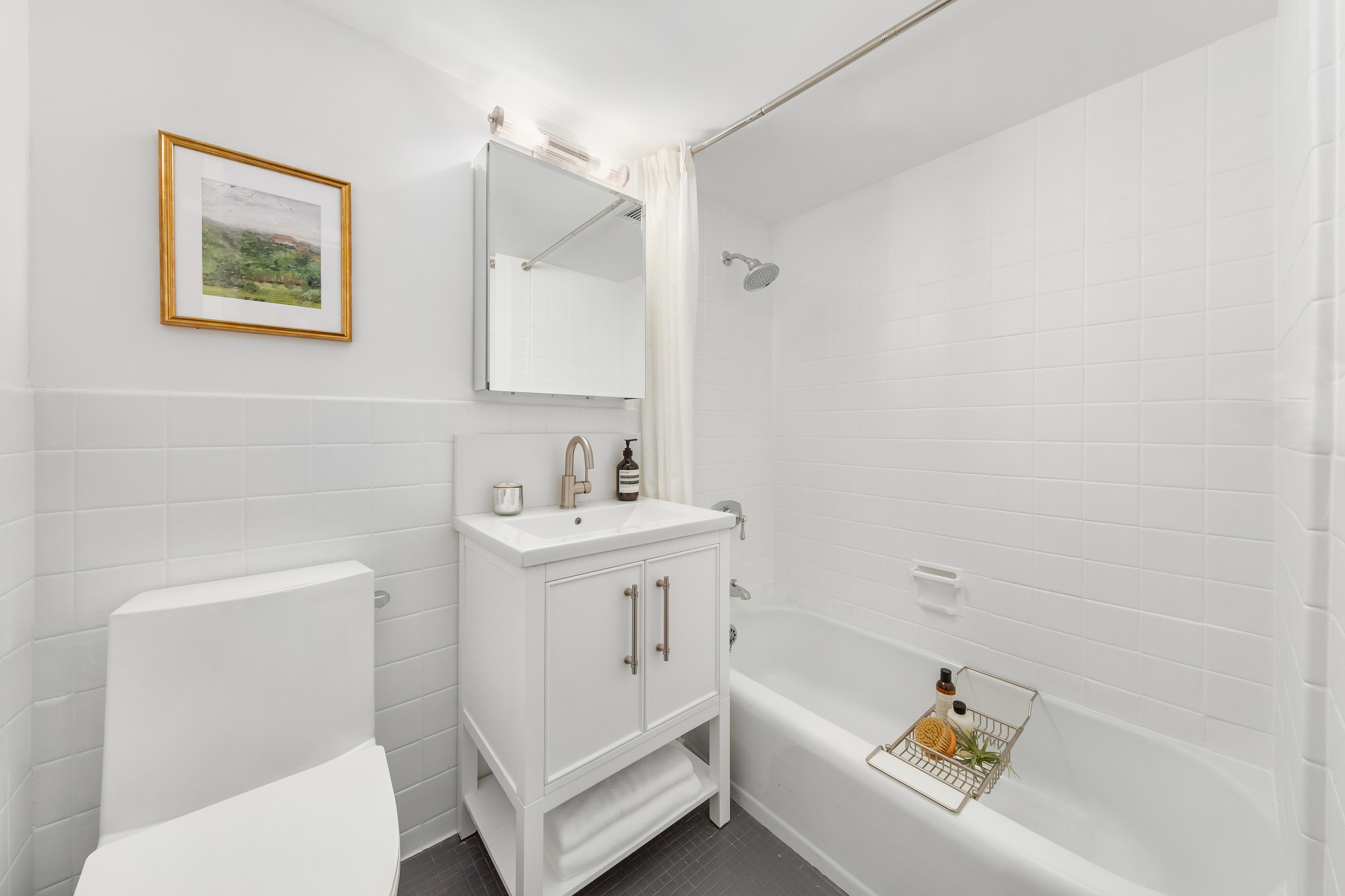 700 Park Avenue, Unit 2B Manhattan, NY 10021 - Photo 18 of 26 a bathroom with a sink and a bathtub