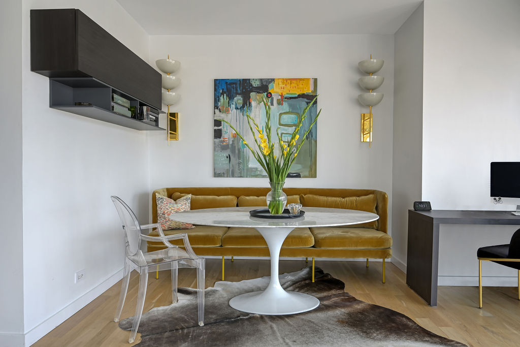 200 East 69th Street, Unit 21C Manhattan, NY 10021 - Photo 4 of 16 a view of a dining room with furniture