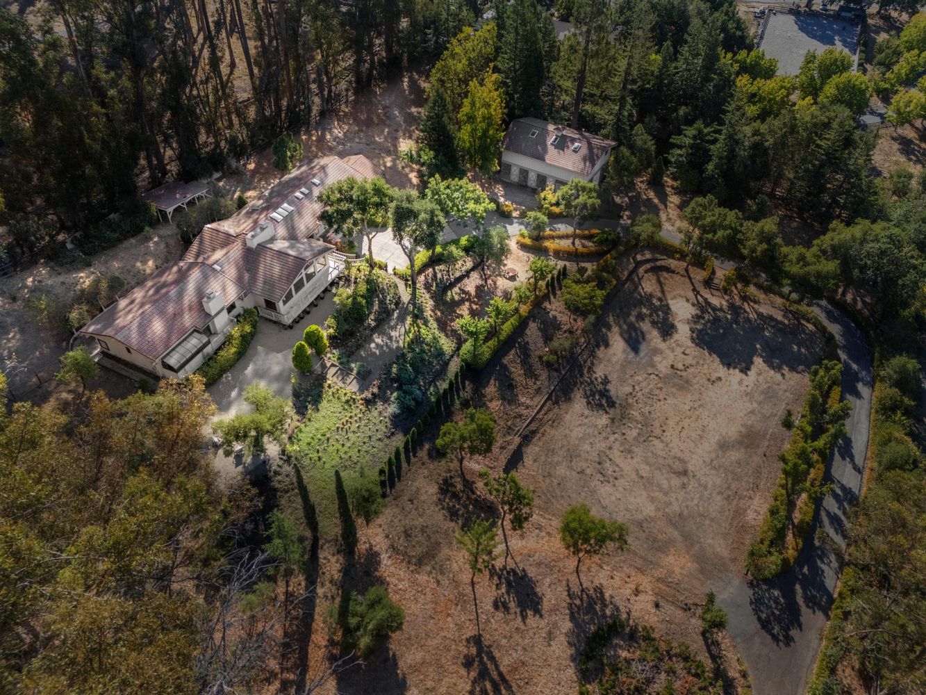 a backyard of a house with a yard with outdoor seating