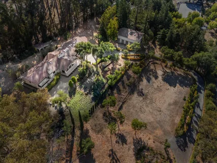 a backyard of a house with a yard with outdoor seating