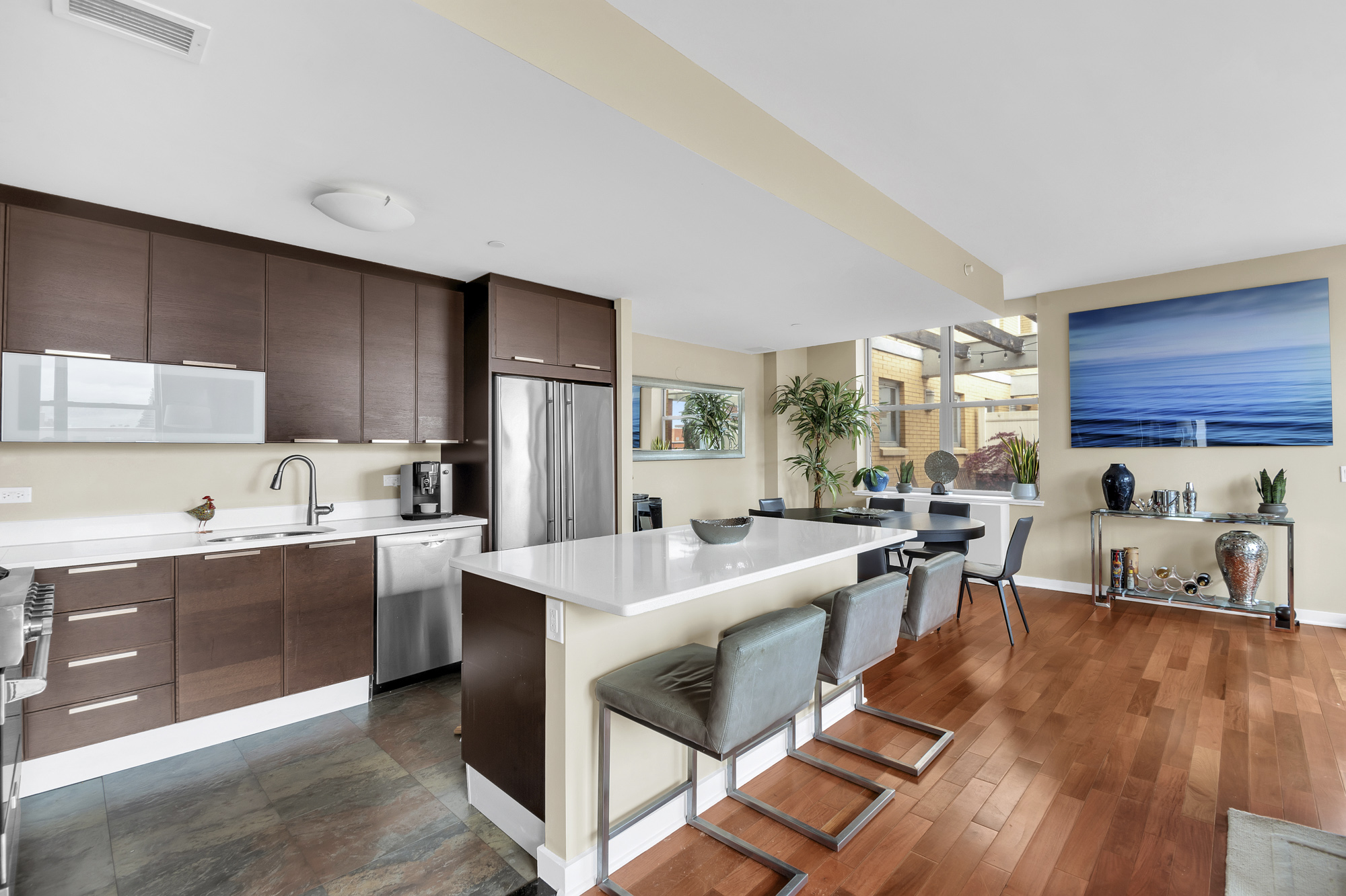 301 West 118th Street, Unit 10G Manhattan, NY 10026 - Photo 4 of 17 a living room with stainless steel appliances granite countertop furniture wooden floor and a view of kitchen