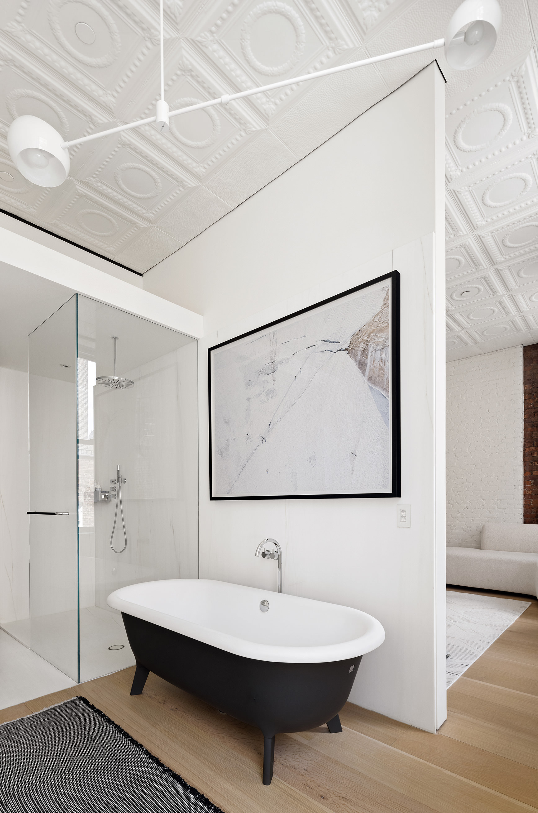 100 Grand Street, Unit 4 Manhattan, NY 10013 - Photo 8 of 13 a bathroom with a sink and a mirror